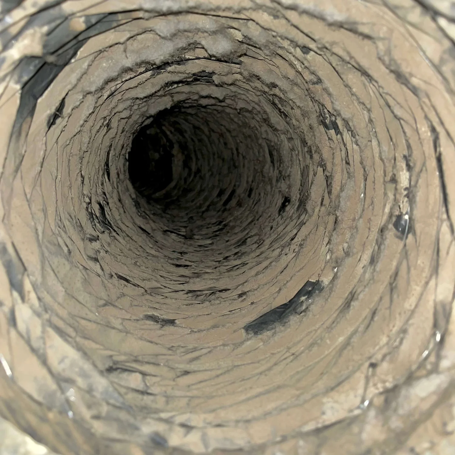 Air duct interior before cleaning with visible accumulated debris
